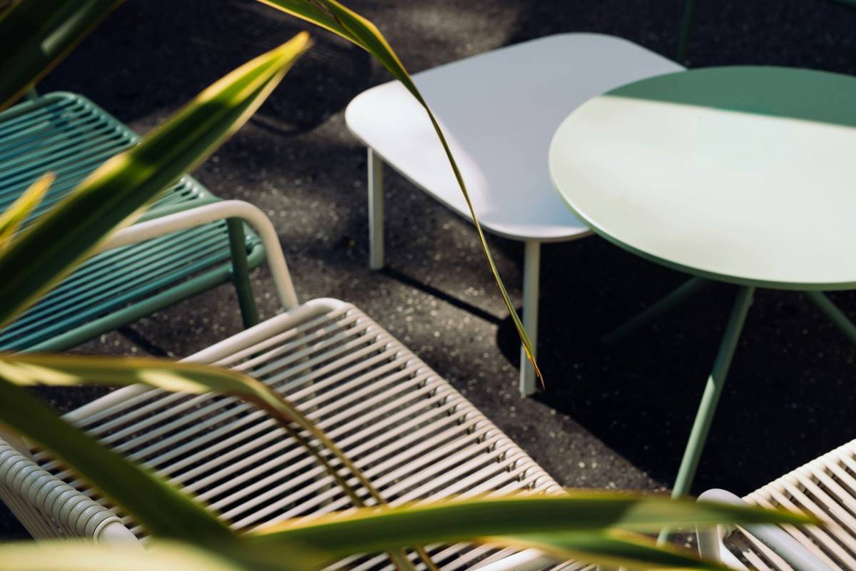 Innovative smart bench with solar panel top, USB ports, and built-in LED lighting in a modern urban park setting